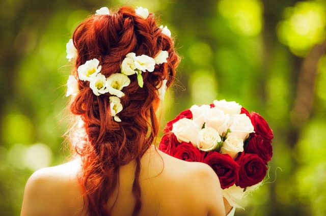 bride-holding-flowers-in-dress